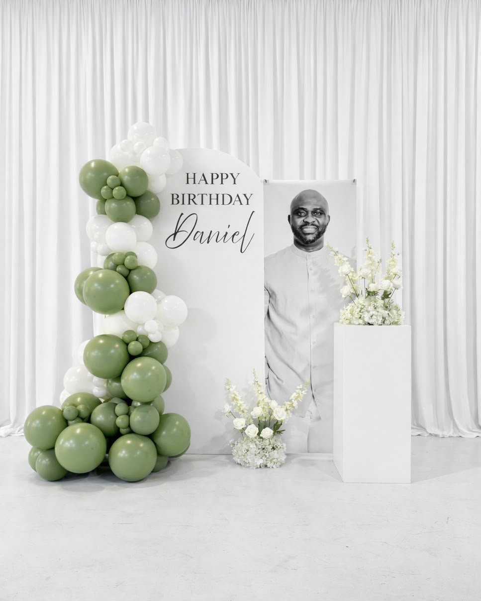 Sage green and white balloon garland birthday arch backdrop by LUX Event Design